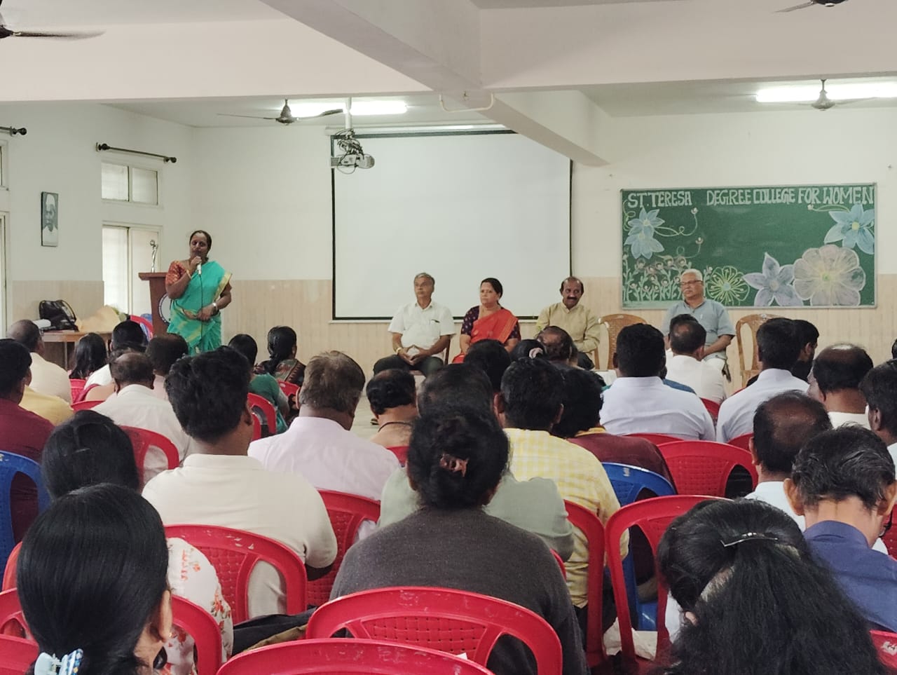 Trainer guiding participant on a computer